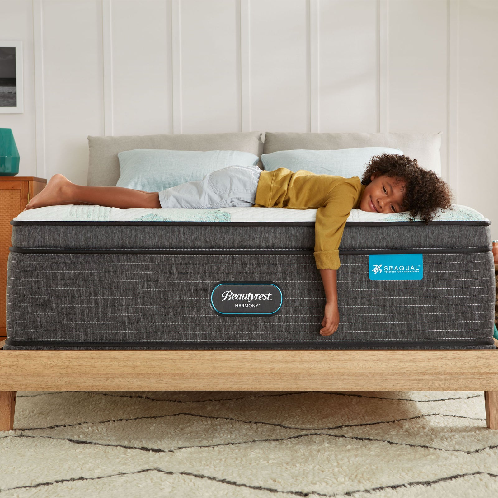person laying on a mattress in a comfortable position
